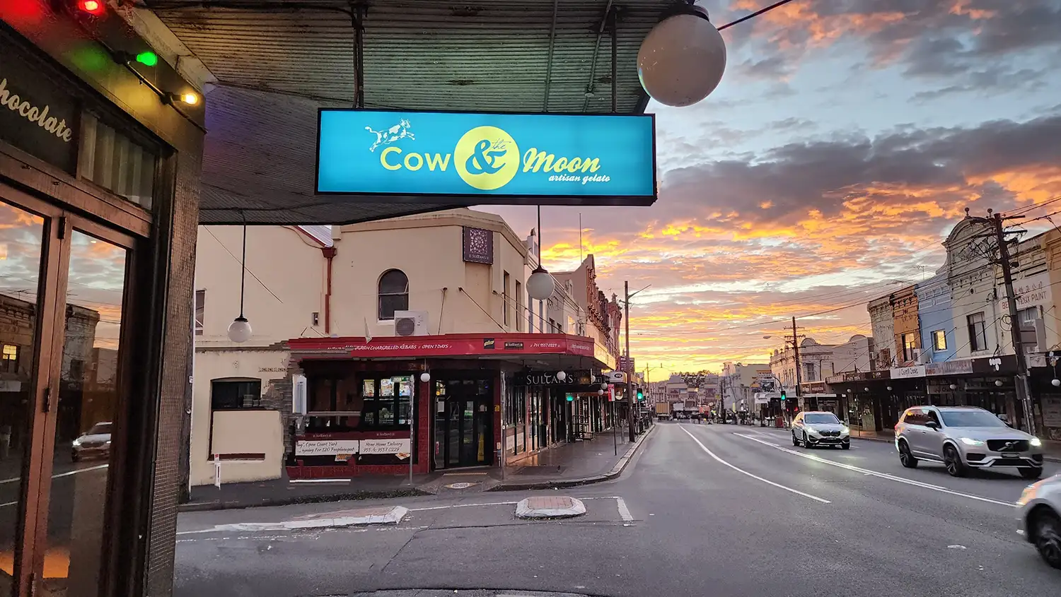 Cow & The Moon lightbox signage at sunrise