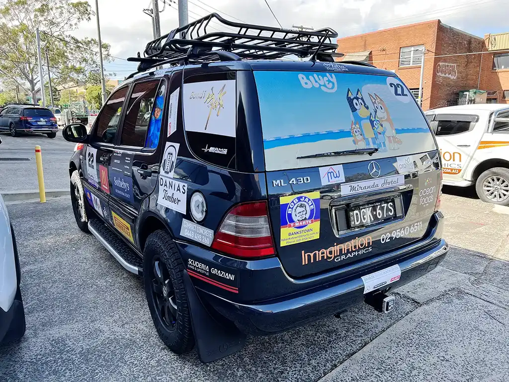 The back of the AMG Sydney Car showing Signage (logos) for the Kidz Fix Rally.