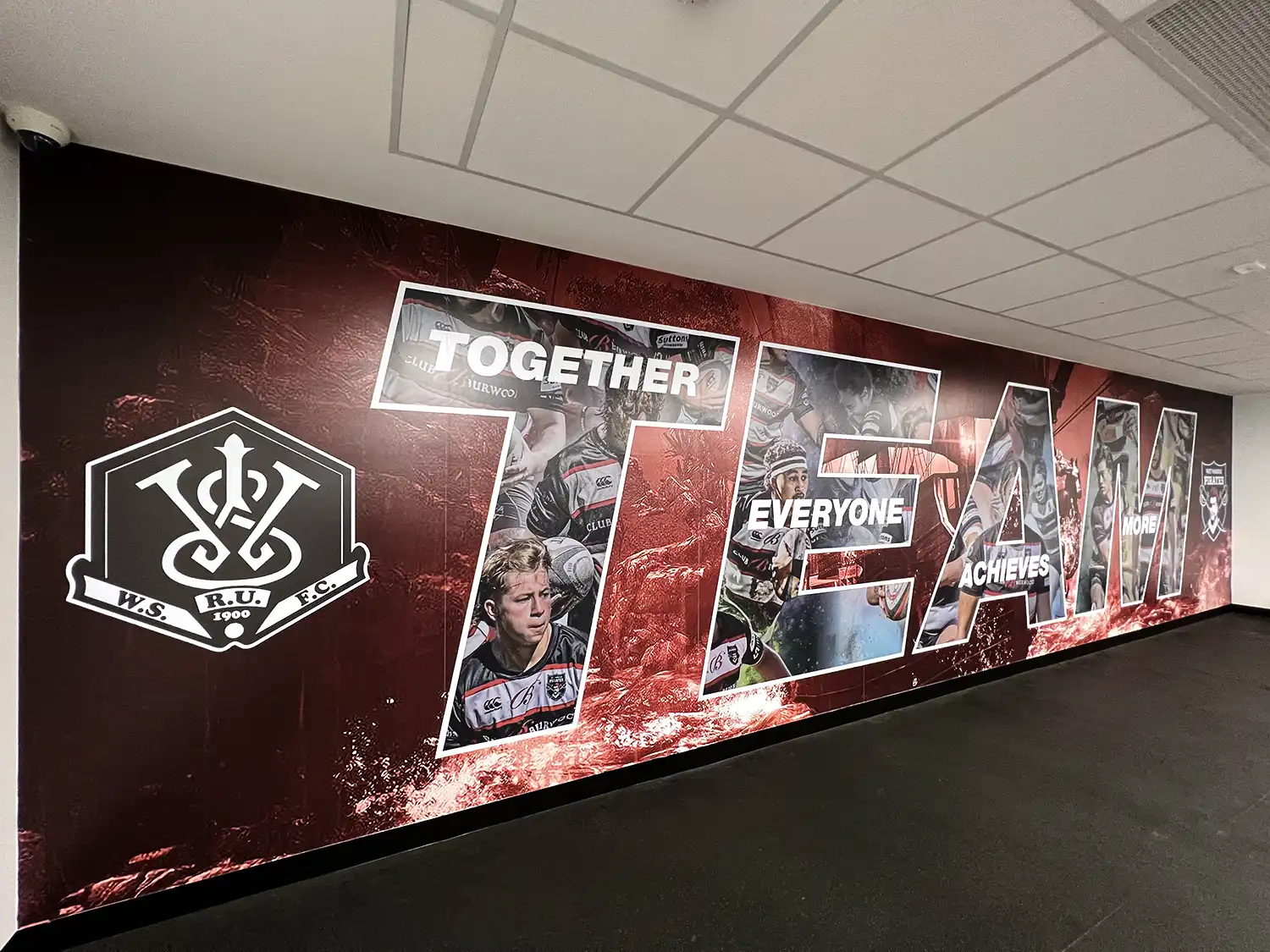 Gym Wall signage titled TEAM - Together Everyone Achieves More.