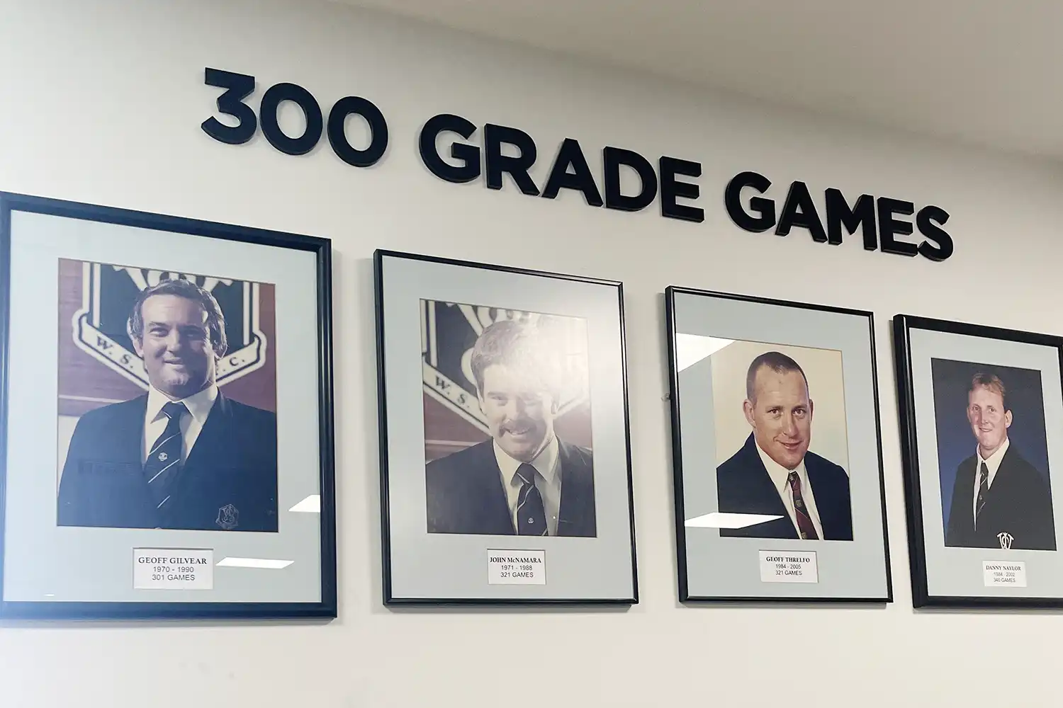 300 Grade Games 3D signage above framed photos on wall